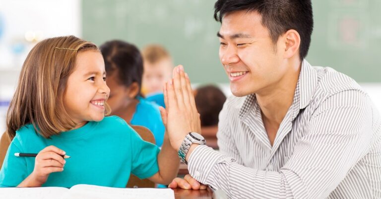 Teacher and student high-five