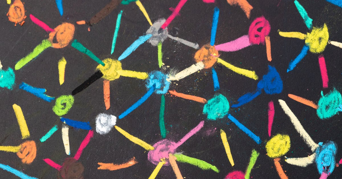 dots connected with multiple colors of chalk on a black chalk board