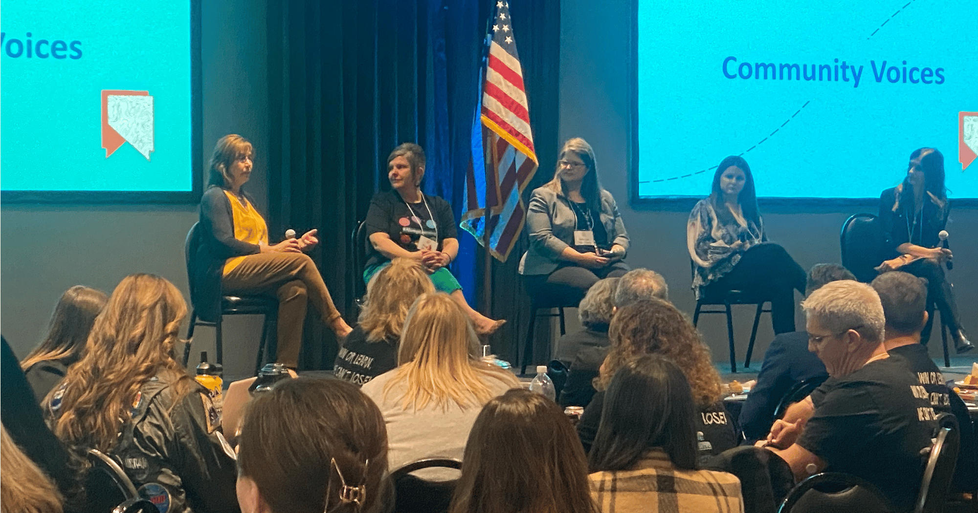A group of five women for community voices panel in front of participants in Nevada's Future of Learning Convening 2022