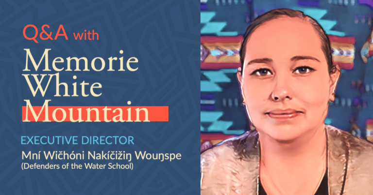 Portrait of Memorie White Mountain, an Indigenous woman with hair pulled back, wearing a tan cardigan and black shirt. Text reads: Q&A with Memorie White Mountain, Executive Director, Mní Wičhóni Nakíčižiŋ Wouŋspe (Defenders of the Water School)
