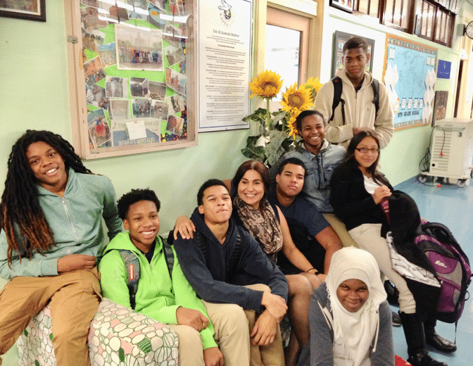 Students at Mastery Collaborative member school KAPPA International High School, Bronx, NY, with Principal Panorea (Penny) Panagiosoulis.