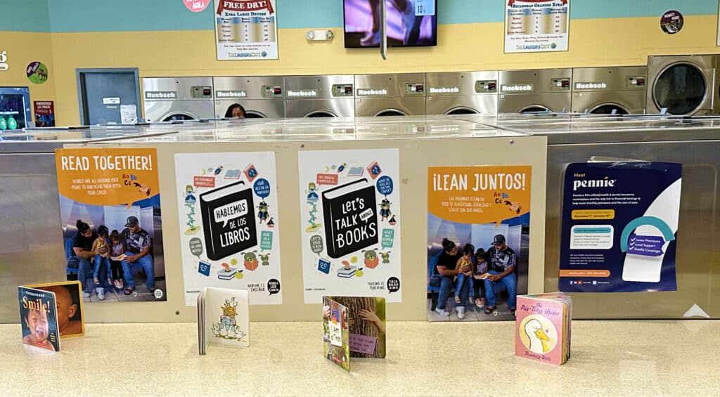 Laundromat with books and signage to engage children in playful learning