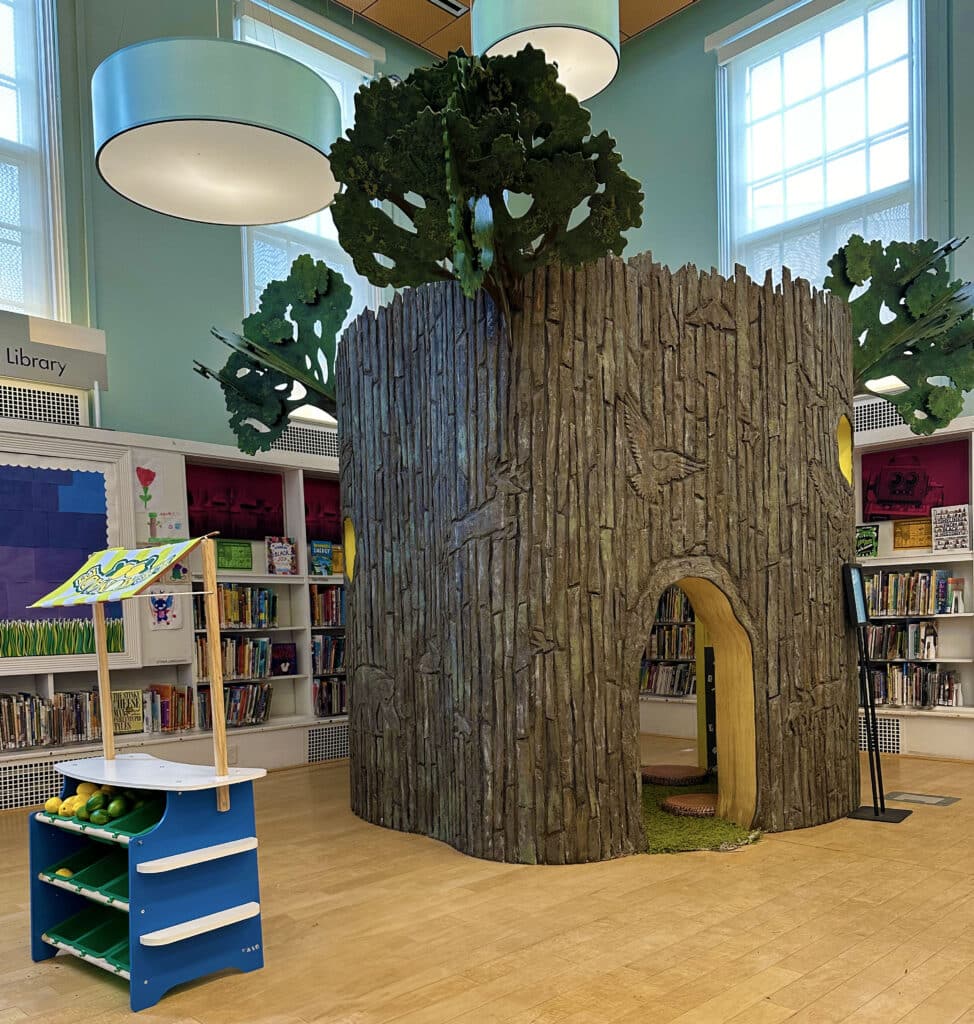 A hollowed out tree in a library setting