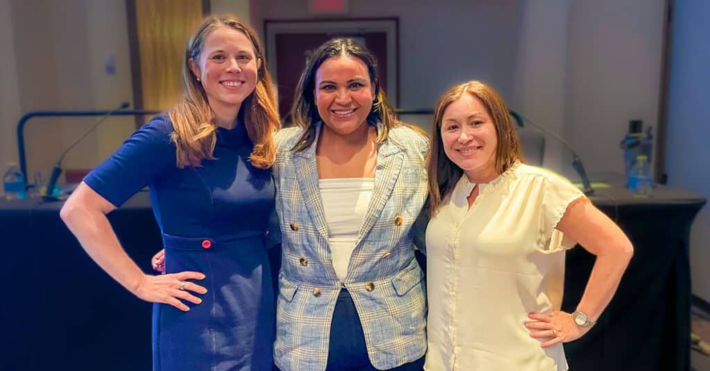 photo of three women of different races/ethnicities smiling at the camera: Lillian Pace, Brenda Calderon and Amalia Chamorro