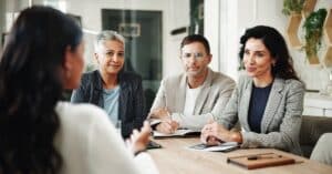 People meeting at a conference table for policy advice